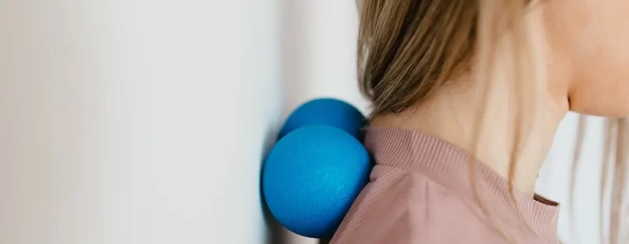 Woman using self myofascial balls on her neck