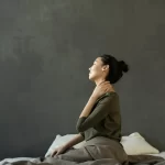Woman using self myofascial technique on her neck